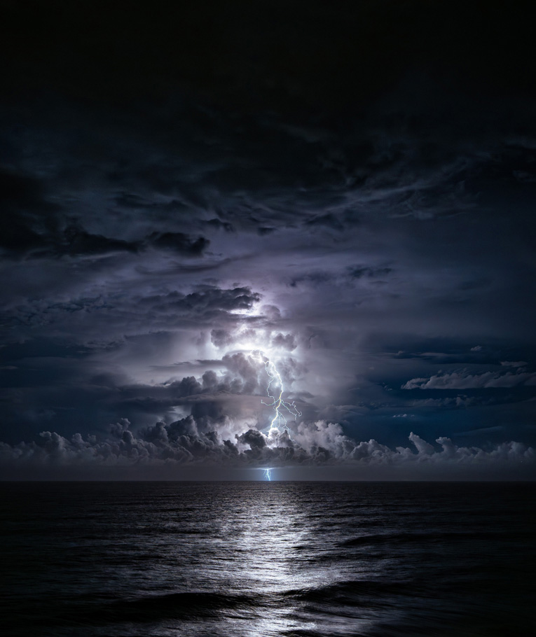 Moonlight ocean lit by stormy sky photographed by Will Eades | Nikon Cameras, Lenses & Accessories