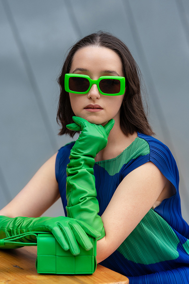 Fashionable young woman wearing green gloves and sunglasses photographed by Karen Woo | Nikon Cameras, Lenses & Accessories