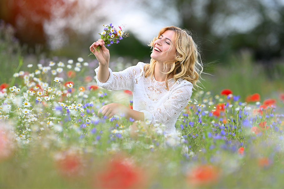 Smiling girl in a field of flowers | Nikon Cameras, Lenses & Accessories
